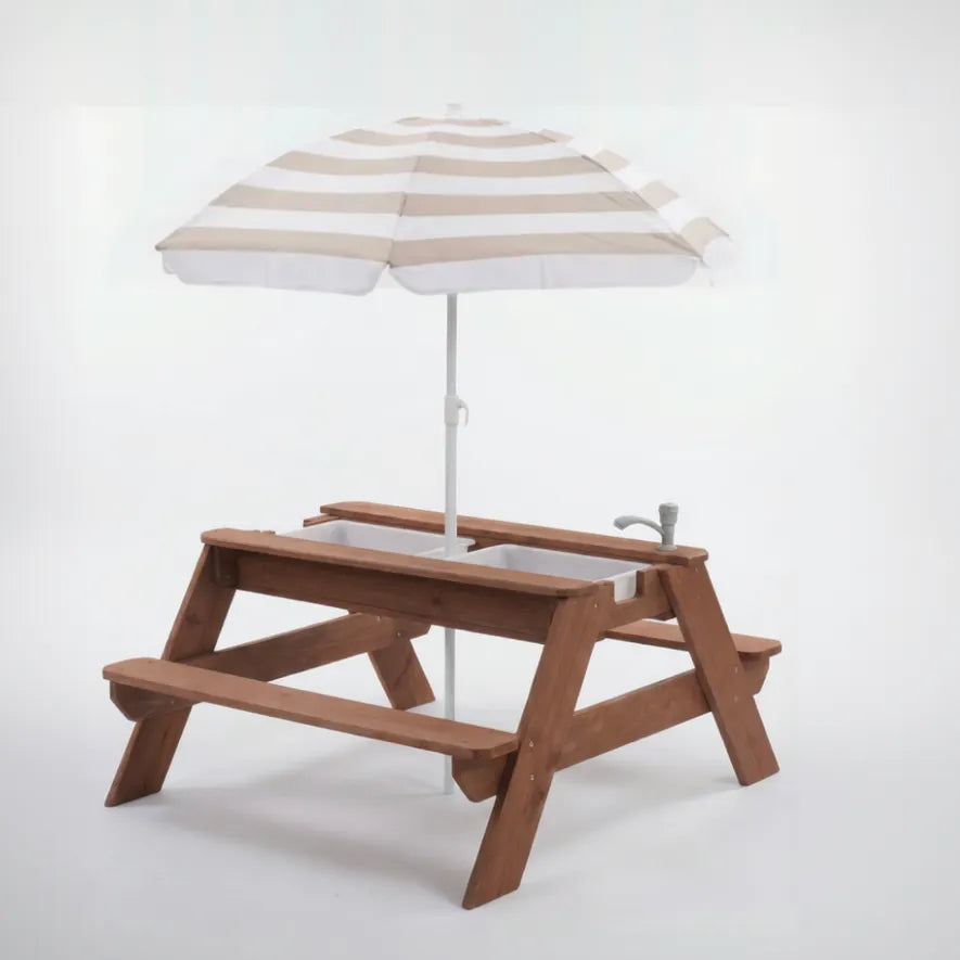 Wooden children's picnic table with a striped umbrella on a white background