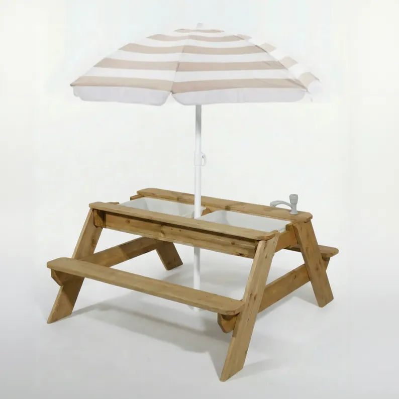 Wooden children's picnic table with striped umbrella on a white background